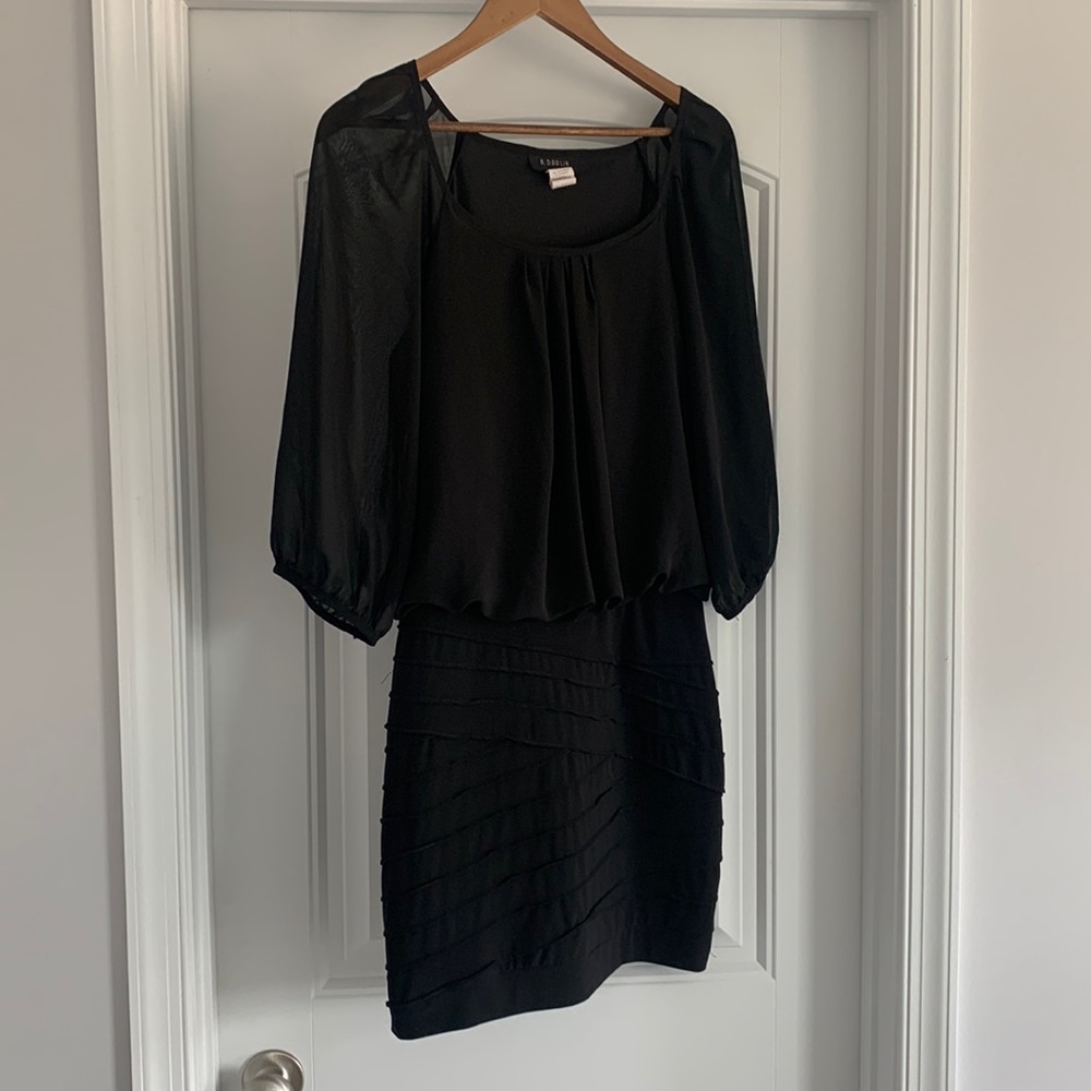 Size L. Sheer sleeved dress with pencil bottom. Black.